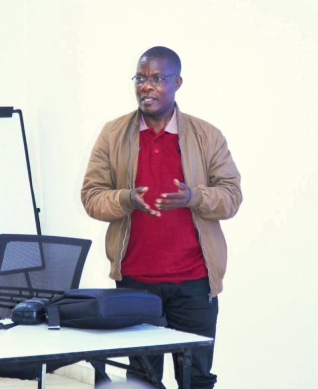 Dr. Zizwa Msukuma presenting at an academic workshop — a candid moment of scholarly engagement