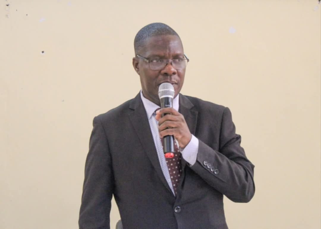 Dr. Zizwa Msukuma addressing an audience — embodying the leadership and governance principles central to his scholarship